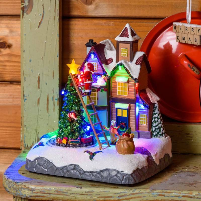 Lotti - Village de noël lumineux animé Père Noël sur échelle et Petit Train Tournant LED Musique Lotti - Imagen 9