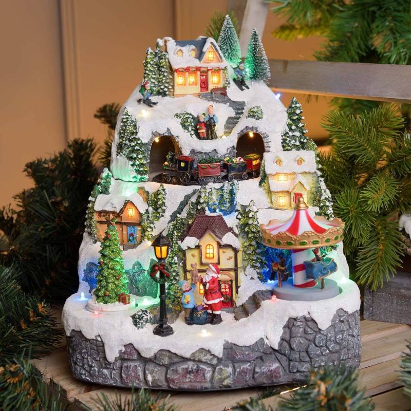 Lotti - Village de Noel animé à LED avec montagne Enneigé Petit Train Sapin de Noël et Père Noël H31cm Lotti - Imagen 1