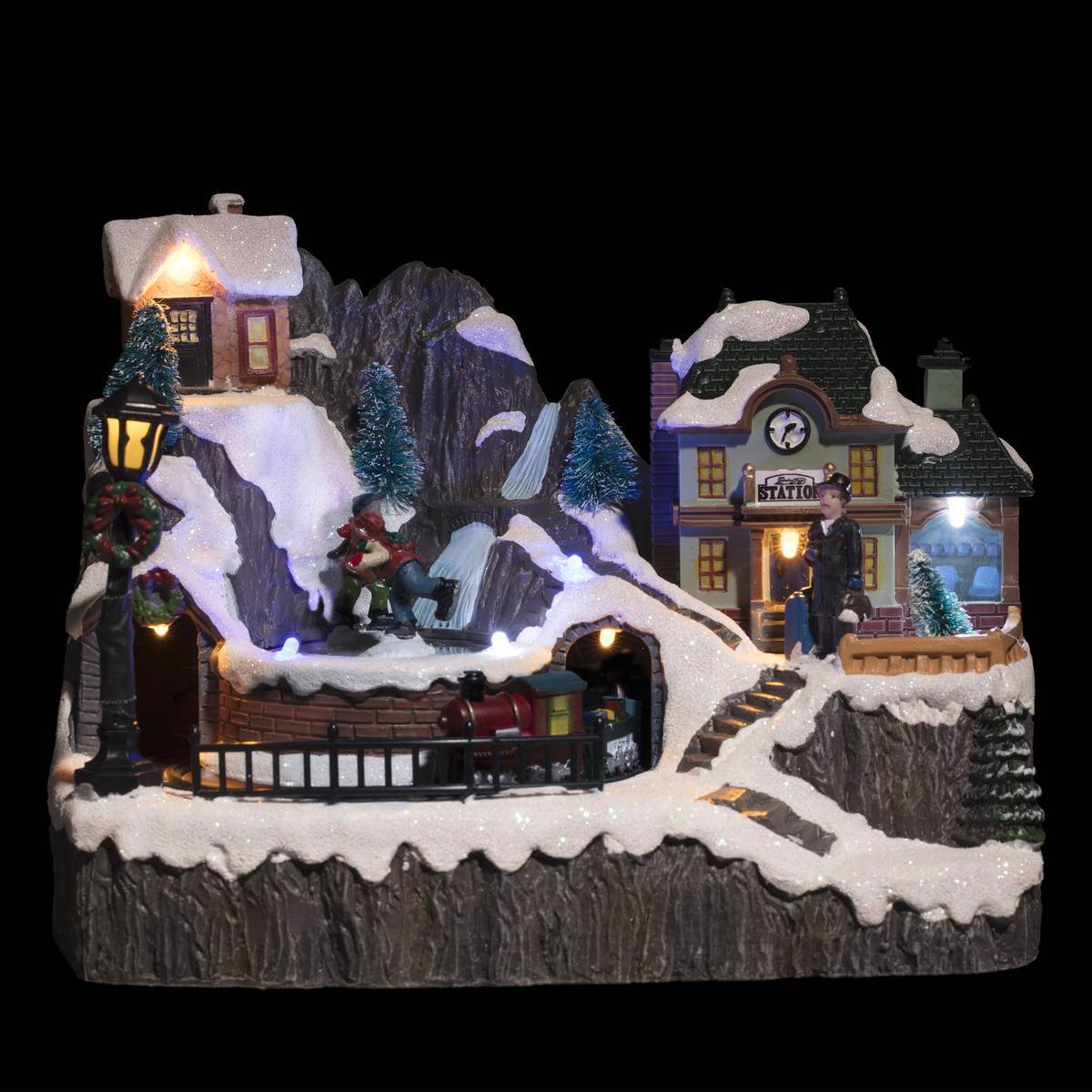 Feeric Christmas - Village lumineux gare et patineurs 9 LED l.23cm musical - Feeric Lights & Christmas - Imagen 1
