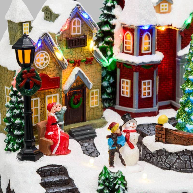 Lotti - Village de Noel lumineux avec petit train en mouvement, Personnages et Sapin en Rotation 32xH28cm avec Musique Lotti - Imagen 7