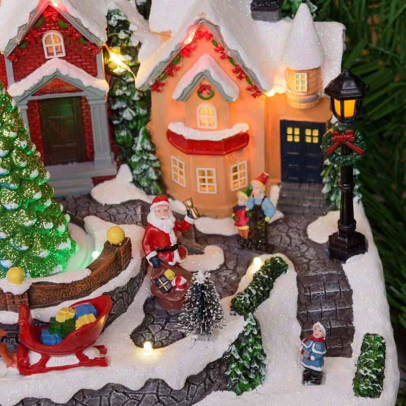 Lotti - Village de Noel lumineux avec petit train en mouvement, Personnages et Sapin en Rotation 32xH28cm avec Musique Lotti - Imagen 5
