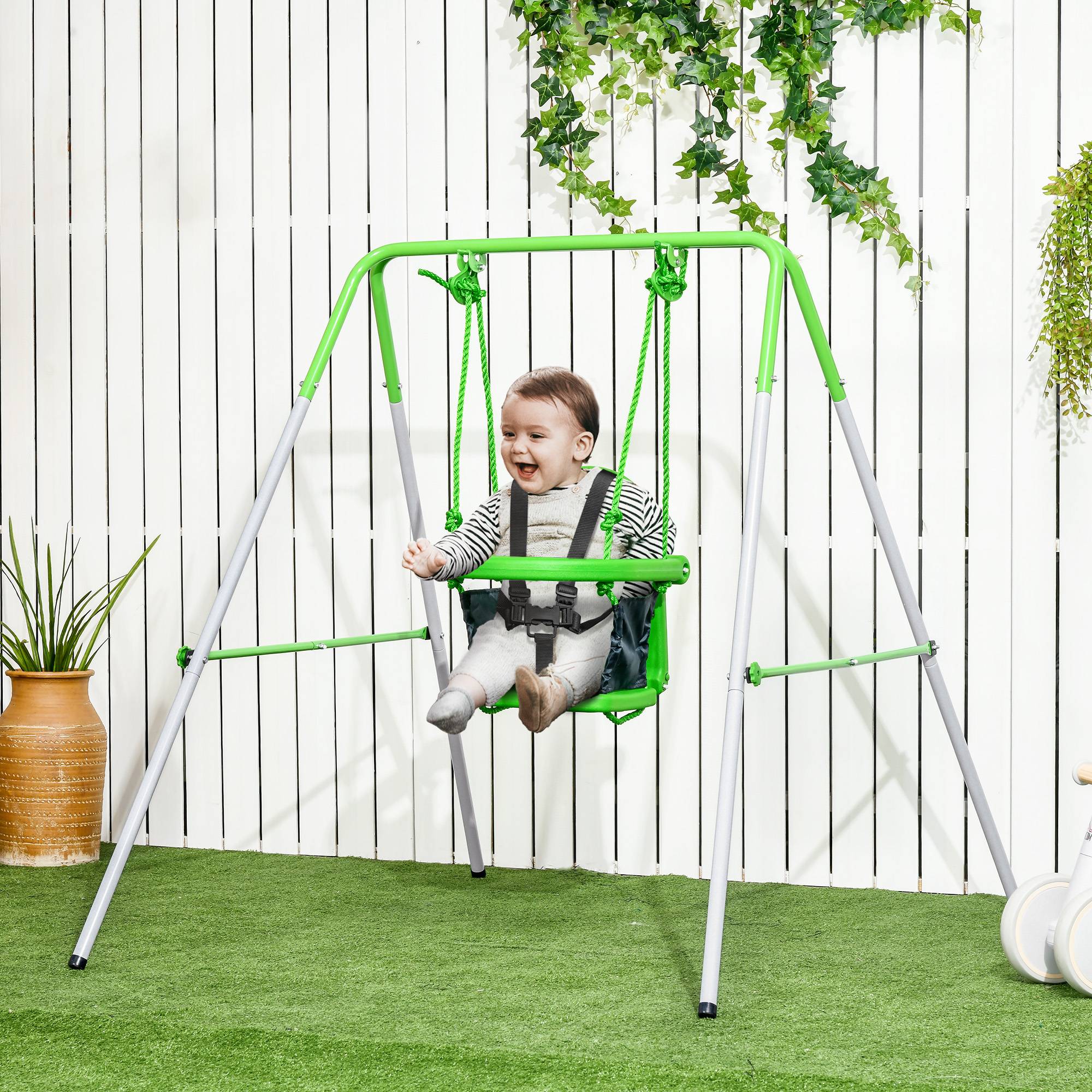 Balançoire enfant 6-36 mois pour jardin et salon, acier et PE, 122×146×122 cm, verte, adaptée à l’intérieur et l’extérieur - Image 1